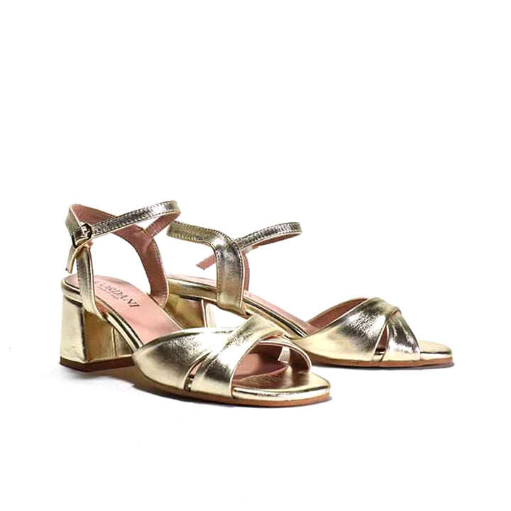 pair of gold criss-cross quarter strap sandals with a wrapped block heel