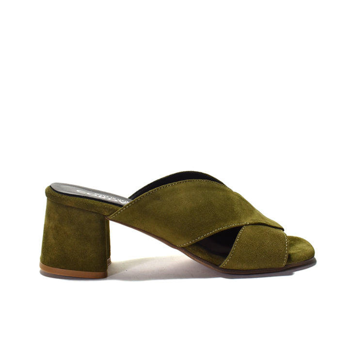 An olive green suede mule sandal with a chunky block heel and crisscrossing front straps, shown from a side profile on a white background.