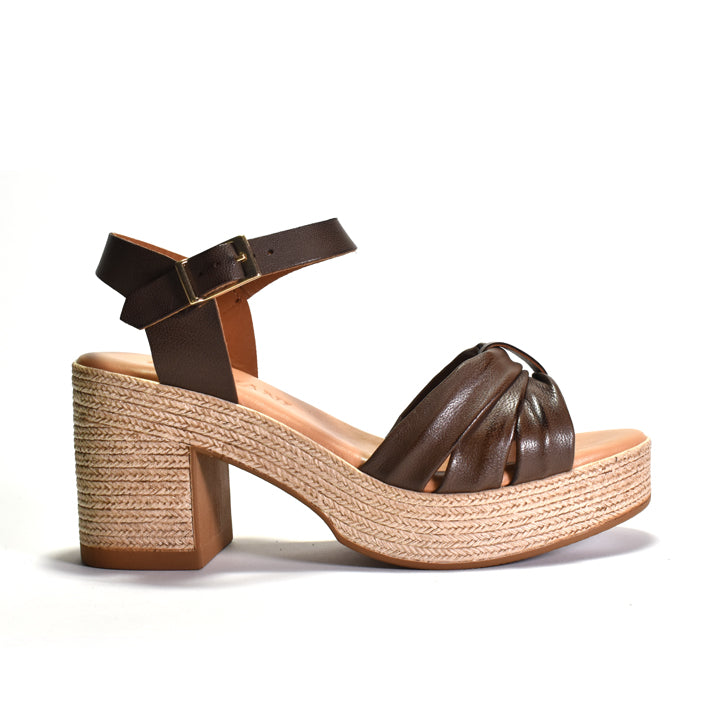 Brown sandal with woven-look sole on a white background