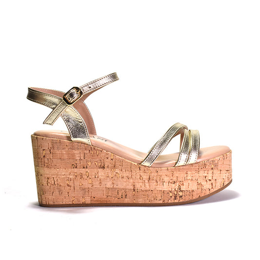 metalic leather sandals with a triple band upper and a quarter strap, featuring a cork wrapped wedge and an adjustable metal buckle.