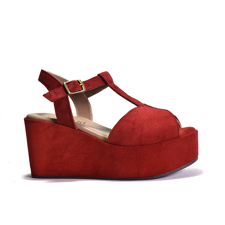 red T strap sandal on rocker bottom