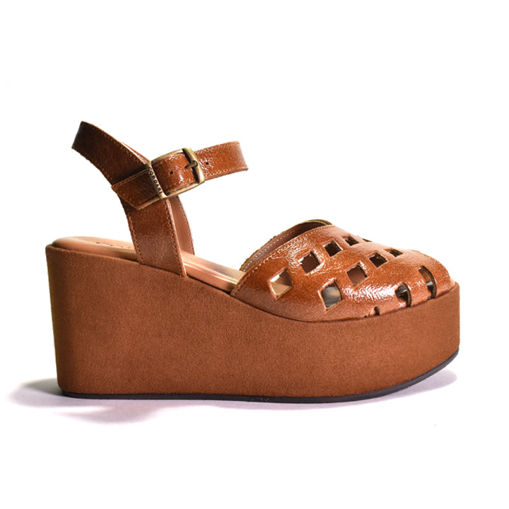 A single brown platform wedge sandal with a cutout toe and ankle strap, shown from a side profile on a white background.