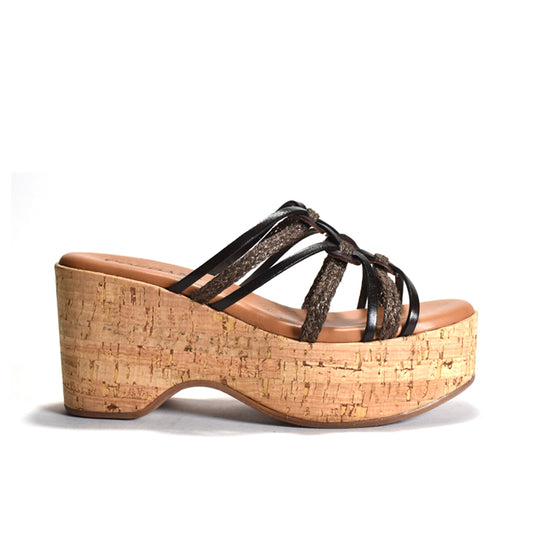 Brown cork wedge sandal with brown straps on a white background