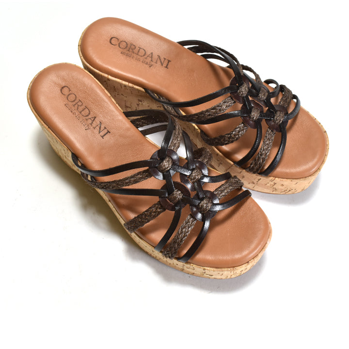 Brown sandals with braided straps on a white background, featuring the Cordani brand.