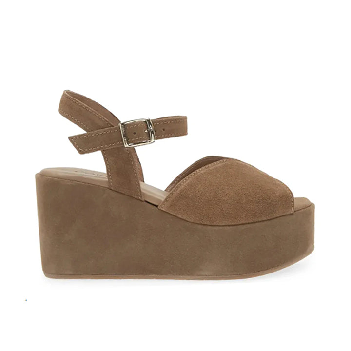 A brown suede platform sandal with an adjustable ankle strap and a wedge heel.