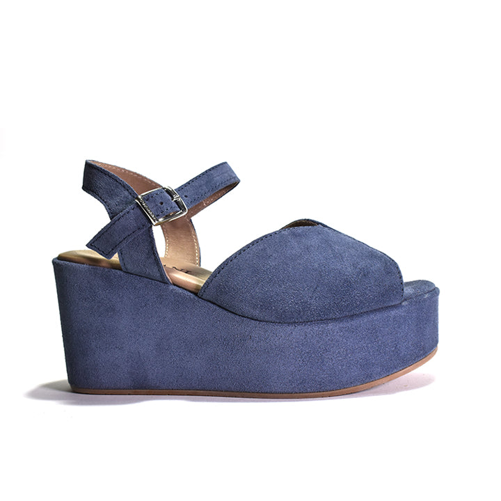 A blue suede platform sandal with an adjustable ankle strap and a wedge heel.
