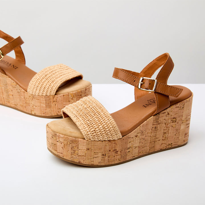 pair of Beige wedge sandals with cork sole 
