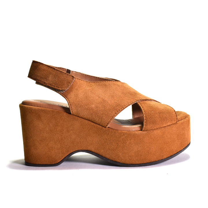 A single tan suede platform wedge sandal with a slingback strap, shown in a side profile view against a plain white background.