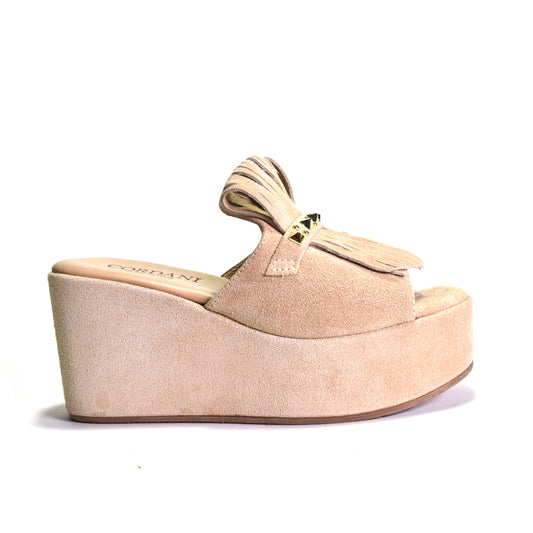 Beige wedge sandal with a bow on a white background