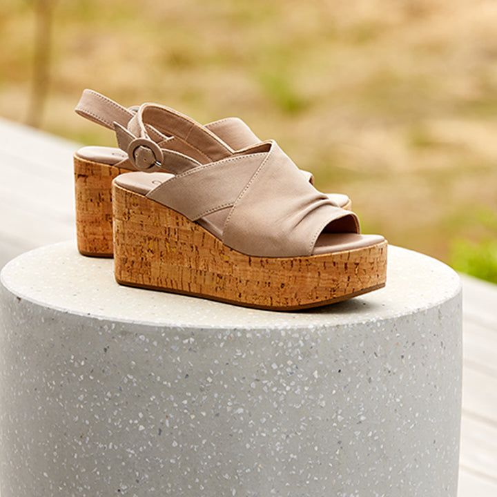 beige leather sling back upper and a Cork wrapped wedge