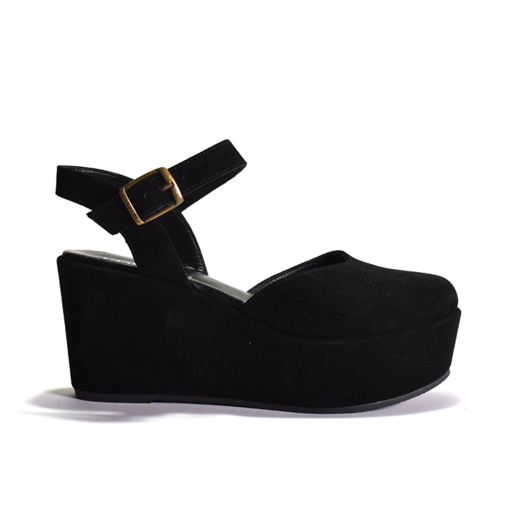 Black wedge sandal with a strap and gold buckle on a white background