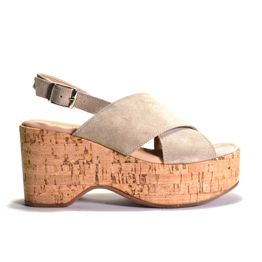 Beige platform sandal with cork sole on a white background