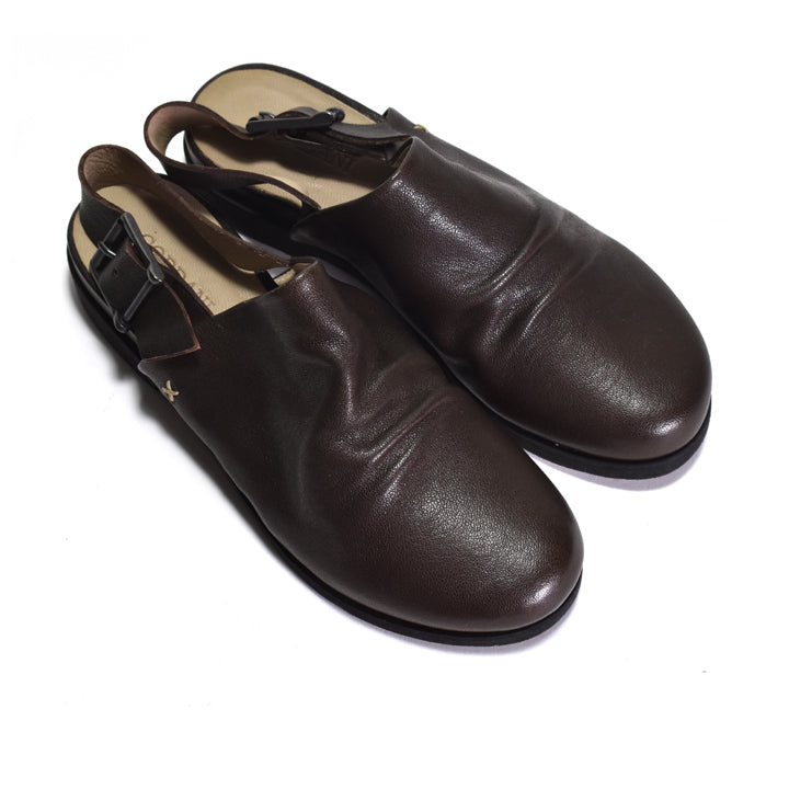 Pair of brown leather shoes on a white background
