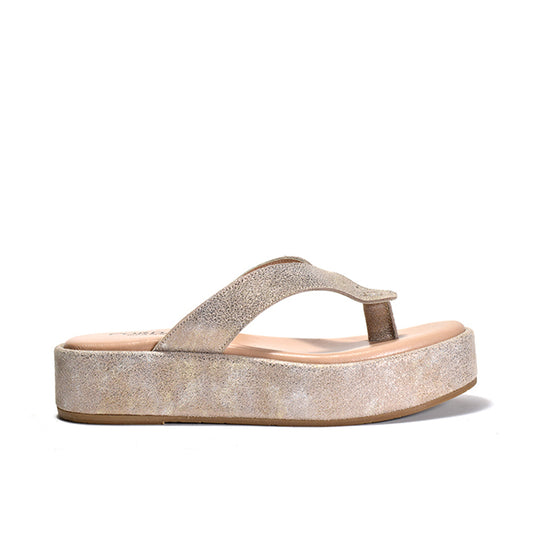A metallic platform sandal with a  thong strap