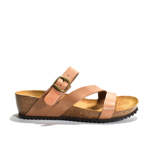 Tan sandal with cork sole on a white background