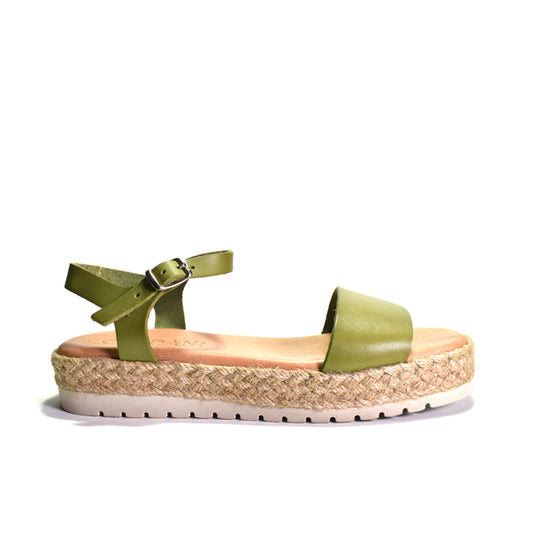 Green sandal with woven sole on a white background