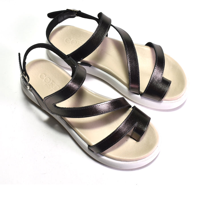 Pewter strappy sandals on a white background