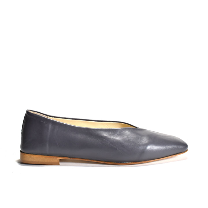 grey flat shoe on a white background