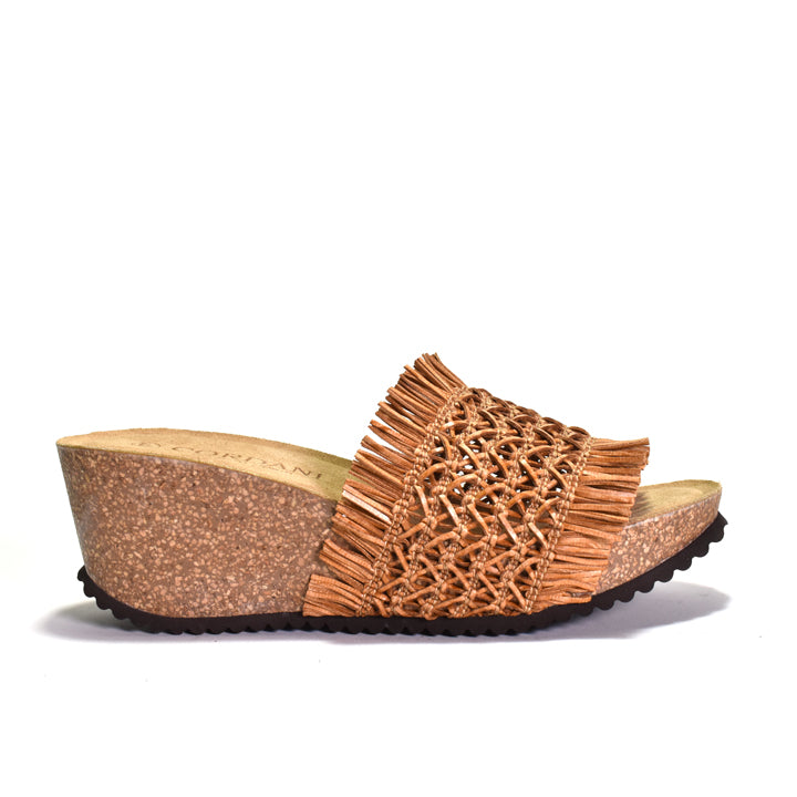 Brown wedge sandal with woven design on a white background