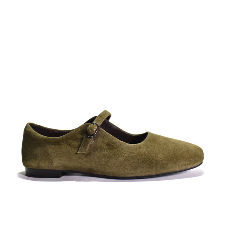 An olive green suede Mary Jane flat shoe with a single strap and a small metal buckle, shown in profile against a white background.