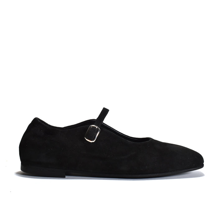 bLACK suede Mary Jane flat shoe with a single strap and a small metal buckle, shown in profile against a white background.