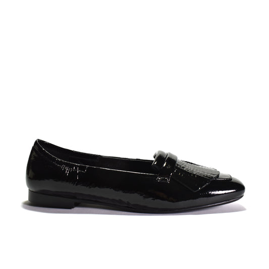 Black leather flat shoe on a light gray background