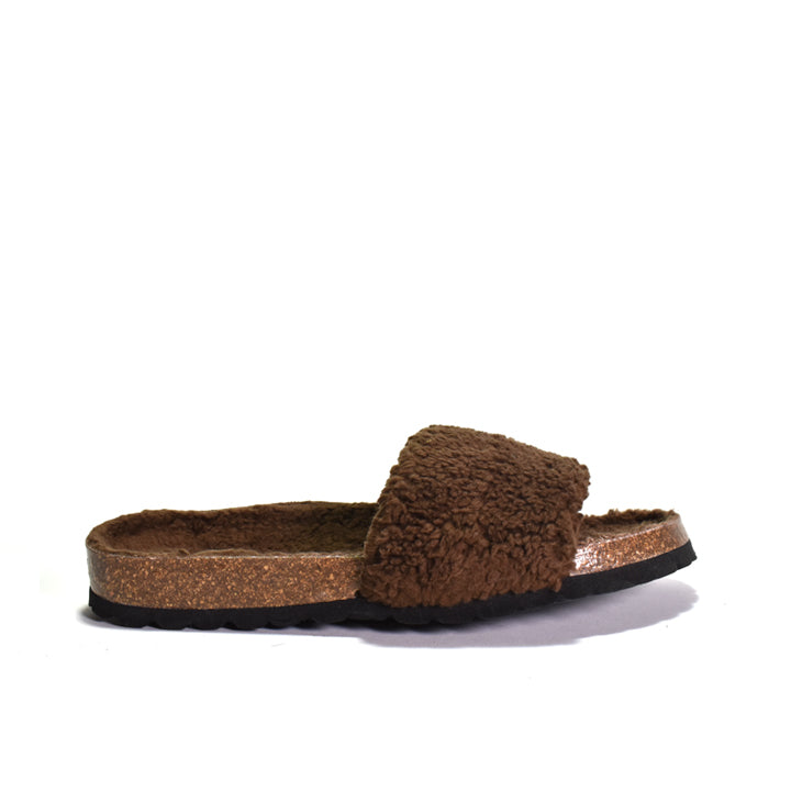 Brown slipper with cork sole on a white background