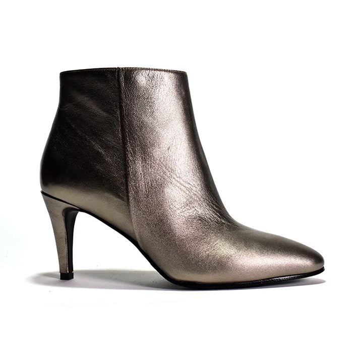A silver suede ankle bootie with a wrapped tapered design