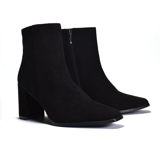 Pair of black ankle boots on a white background
