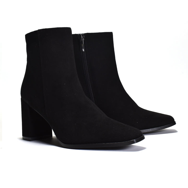 Pair of black ankle boots on a white background