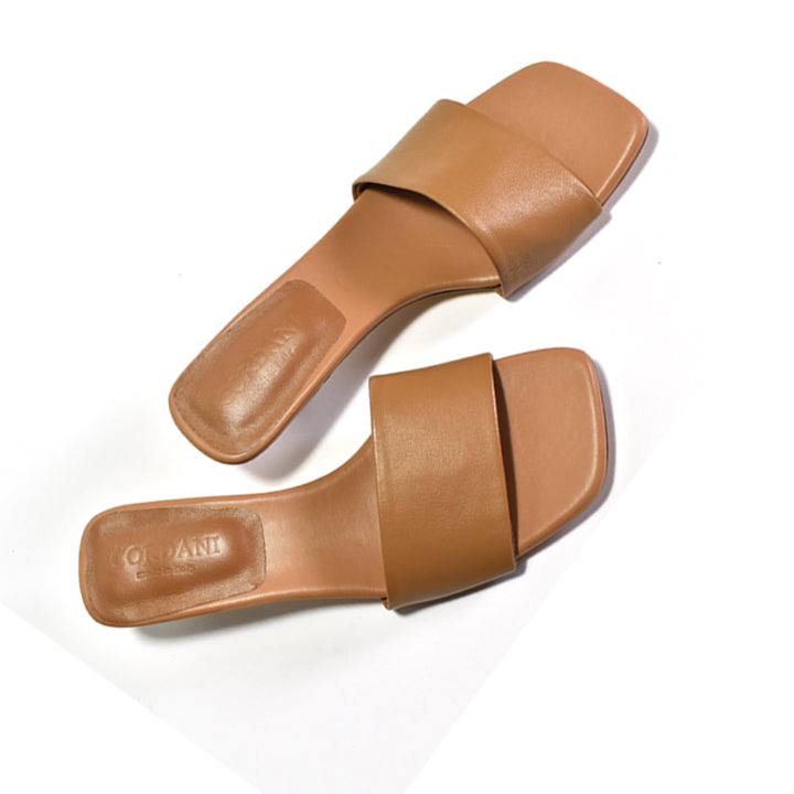 A pair of tan leather slide sandals with square toes, displayed on a clean white background.
