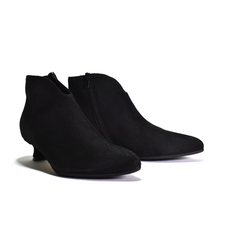 A pair of black suede ankle boots with low kitten heels and side zippers, shown on a clean white background.