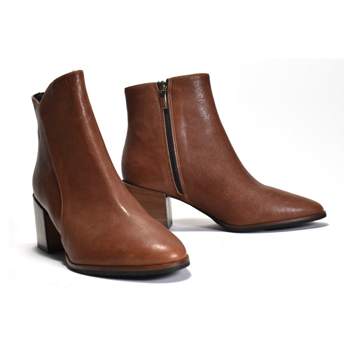 Pair of brown leather ankle boots with a zipper on a white background
