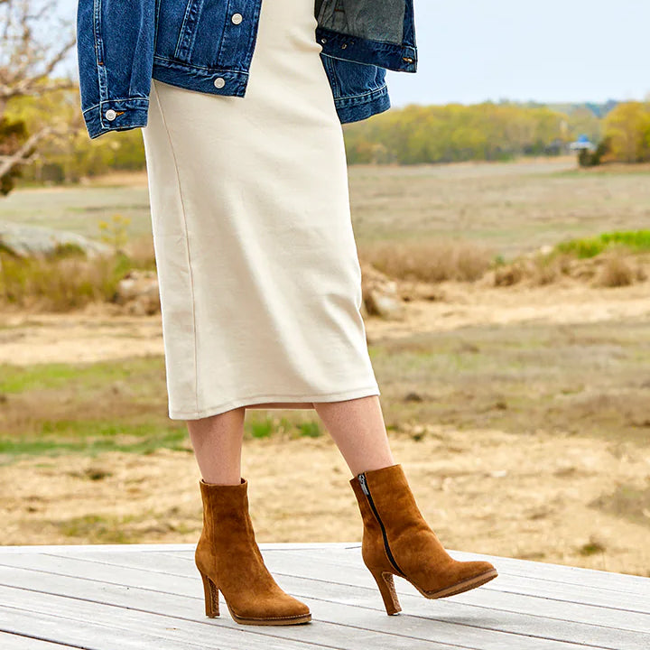 brown suede ankle boot with a wrapped tapered heel and outer sole stitch detail.