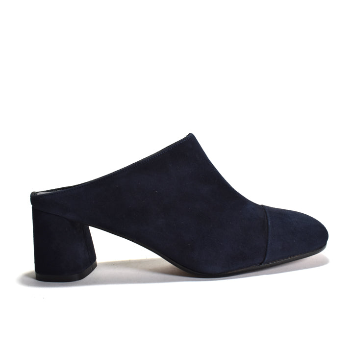 Navy blue suede mule shoe on a white background