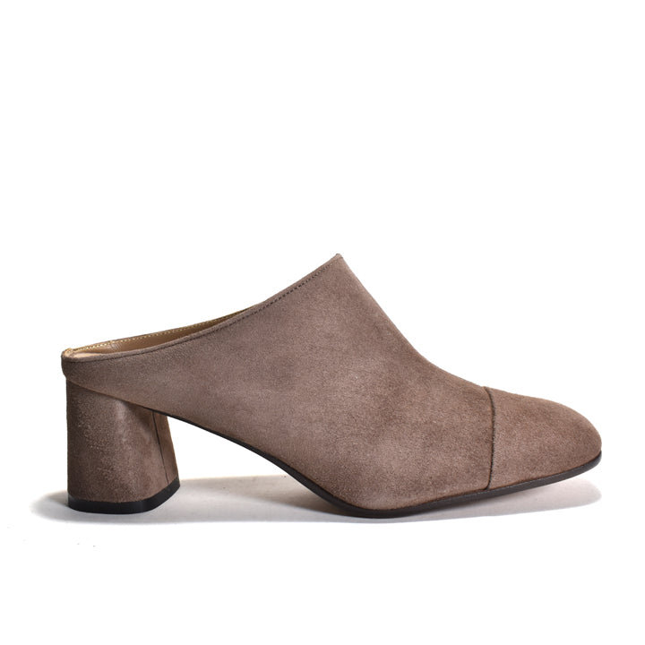 Brown suede mule shoe on a white background