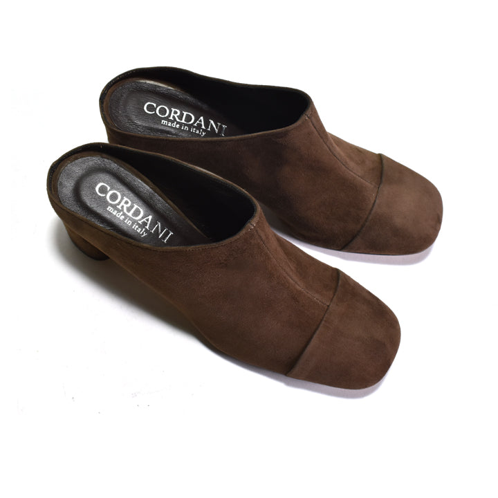 Pair of brown suede clogs with 'Cordani' branding on a white background
