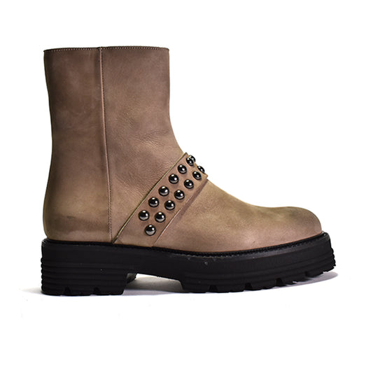 Brown leather boot with studded details on a white background