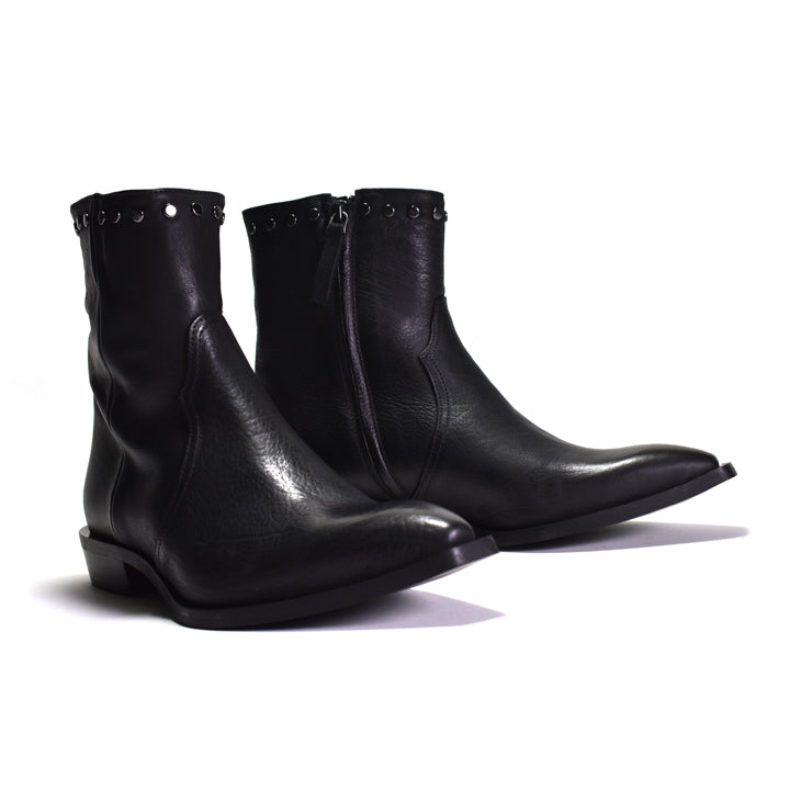 Pair of black leather boots with studded details on a white background