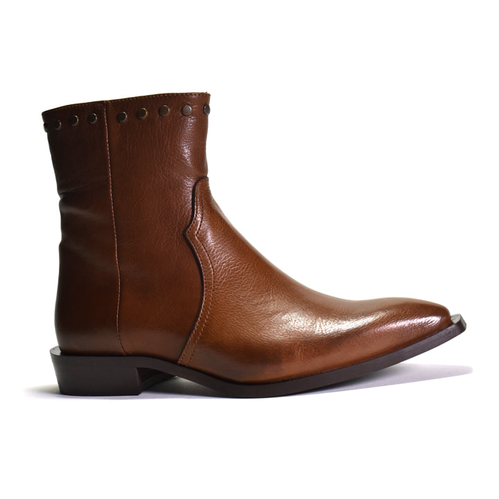 Brown leather boot with studded details on a white background