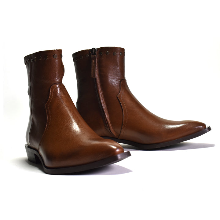 Pair of brown leather boots on a white background