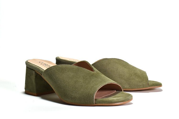 pair of Green suede mule sandal with a wrapped block heel and open toe