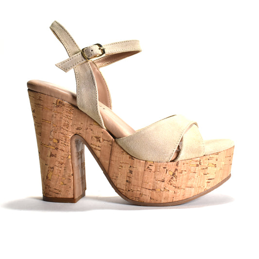 beige high-heeled sandal with cork platform on a white background