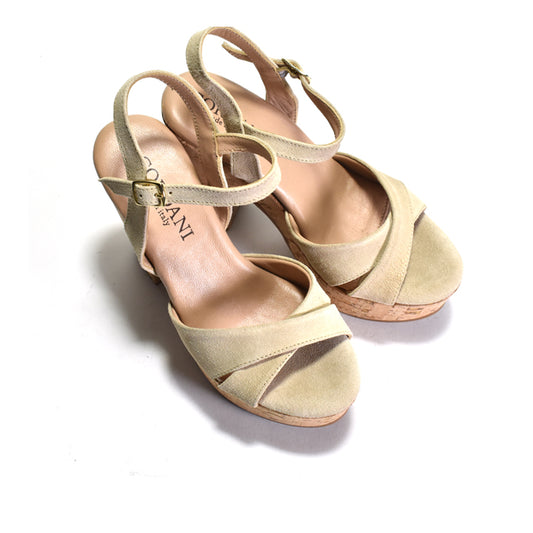 pair of beige high-heeled sandal with cork platform on a white background