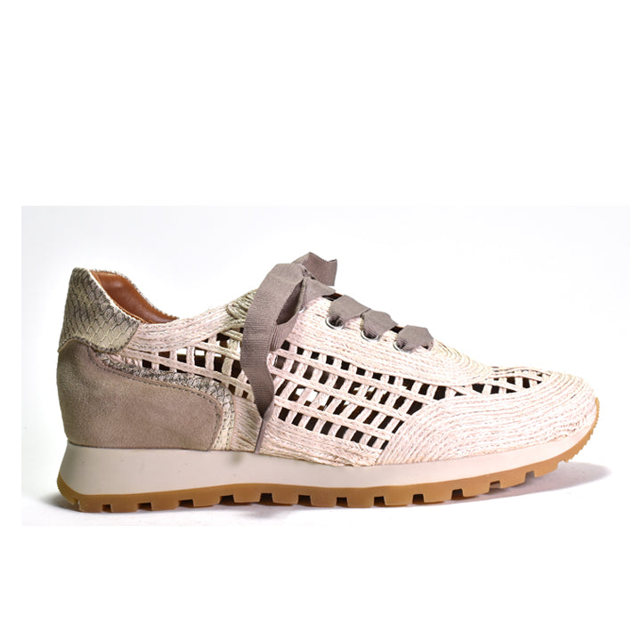 Sneaker with woven pattern and beige sole on a white background