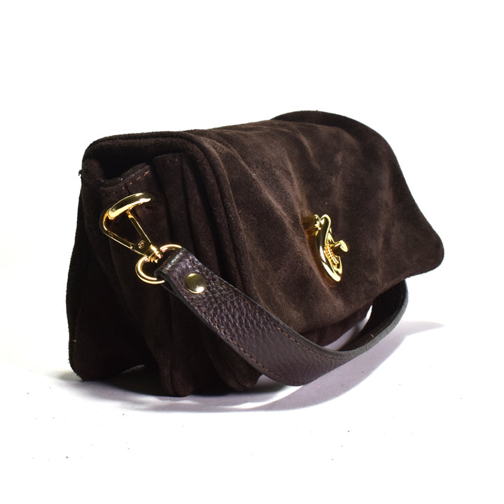 Brown suede handbag with gold hardware on a white background