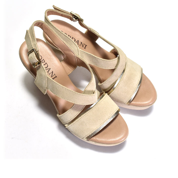 Beige sandals with metallic accents on a white background