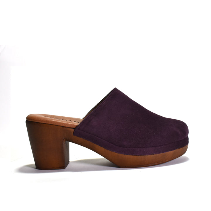 Purple clog shoe with brown sole on a white background