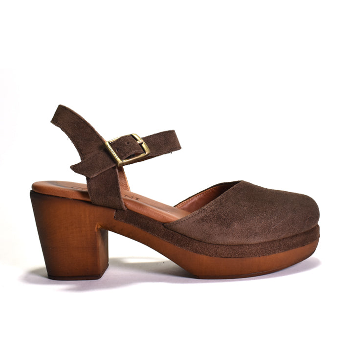 Brown suede platform shoe with wooden heel on a white background