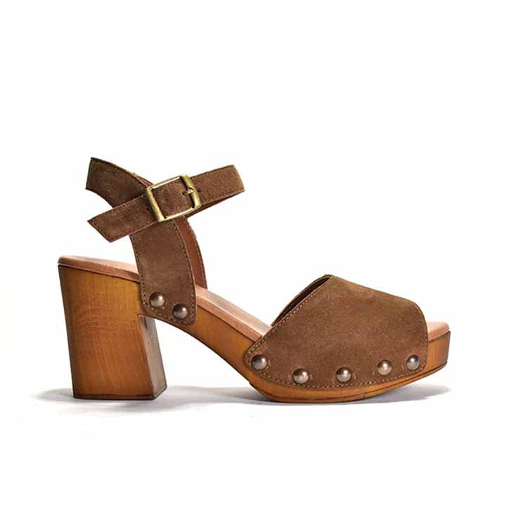Brown sandal with ankle strap and stud detail, on a wood-like platform heel.
